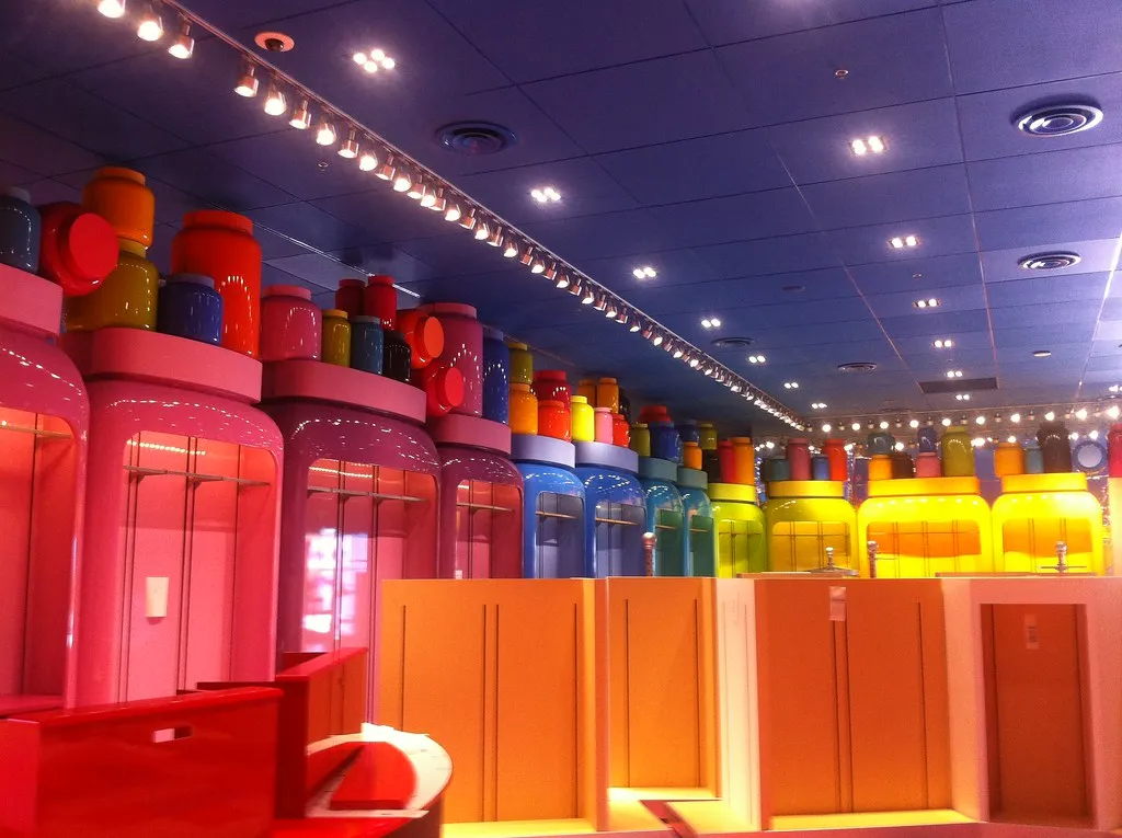 A themed building lit at dusk at Disney's Art of Animation Resort