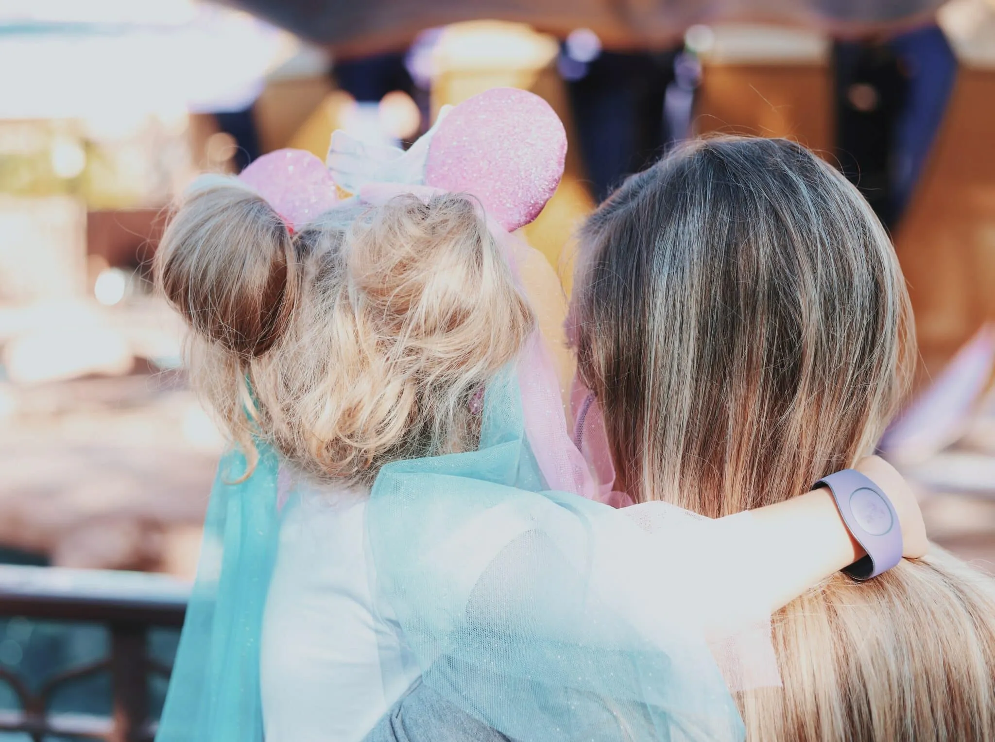 a woman and two girls wearing clothing