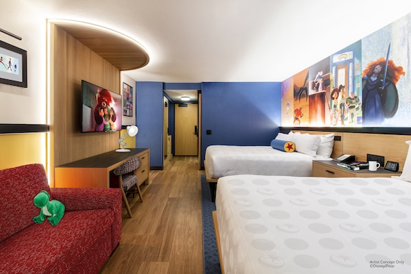 a room with two beds and a tv