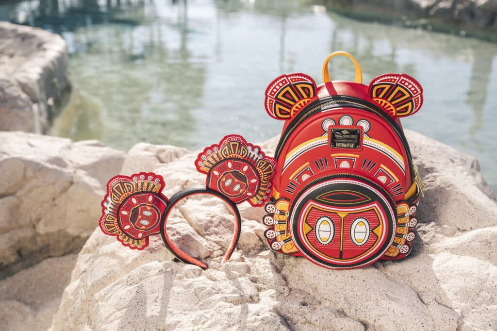 a backpack and headband on a rock
