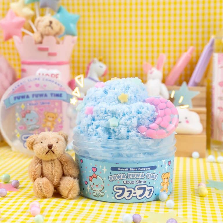 a toy bear next to a container of cloud slime