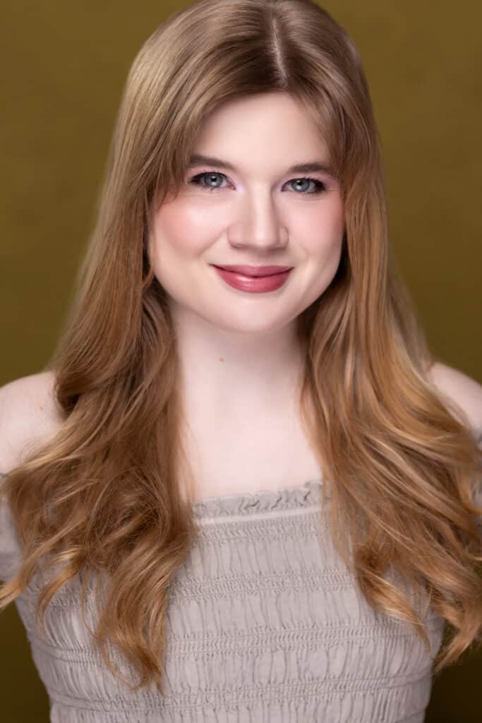 a woman with long hair smiling